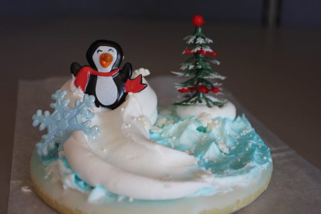 A penguin going down a buttercream slide on a 5-inch decorative cookie for $2.79 each at By the Dozen Bakery in Machesney Park. REBECCA ROSE/STAFF PHOTOGRAPHER/RRSTAR.COM