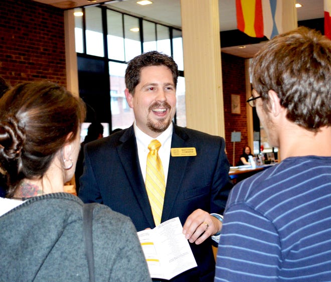 Cape Cod Community College Admissions Director Matt Cormier talks with potential students at a recent open house event. COURTESY PHOTO