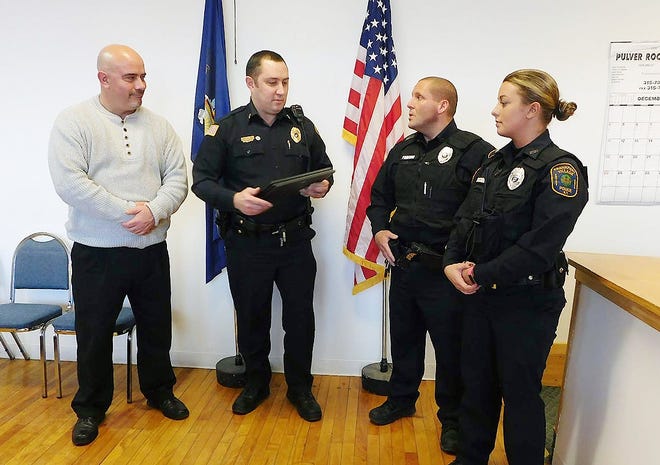 From left are Frankfort Village Mayor Richard Adams, village Police Chief Ronald Petrie and Village Police Officers Michael Perritano and Tia Zaccaria. Petrie presented Life Saving Awards to Perritano and Zaccaria Friday in recognition of their actions in a July 4 rescue at the Frankfort Marina. TIMES TELEGRAM PHOTO/DONNA THOMPSON