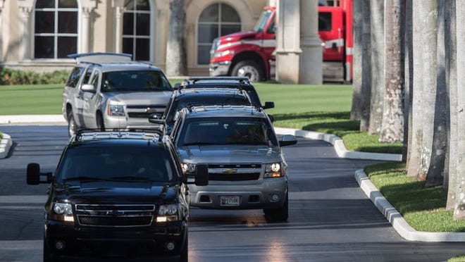 Donald Trump’s motorcade leaves Trump International Golf Club after the president-elect played a round of golf with Tiger Woods in West Palm Beach, Florida on Friday, Dec. 23, 2016. (Allen Eyestone / The Palm Beach Post)