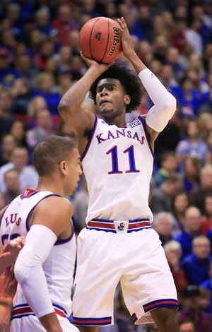 Kansas guard Josh Jackson (11) shoots a basket during the first half of an NCAA college basketball game against Nebraska in Lawrence, Kan., Saturday, Dec. 10, 2016. Jackson scored 17 points in the game. Kansas defeated Nebraska 89-72. (AP Photo/Orlin Wagner)