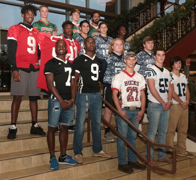 Front row, from left Bozeman's Triston Tiller, North Bay Haven's Tyler Pegnataro, Justin Bayless. Row two, from left Rutherford's Malik Gibson, E.J. Foster, Arnold's Jarrett Dutton, Chandler Marshall, Row three, Bay's Anthony Hayes, Jersey for Demond Ross, Lurhann Smith, Arnold's Nick Guzman, Tristan Patterson, and Chuck Taylor. Row four, from left, Trenton Gibbens, Chris Creel and Jamal Henderson stand for photos on Dec. 14 at First Baptist Church of Panama City.