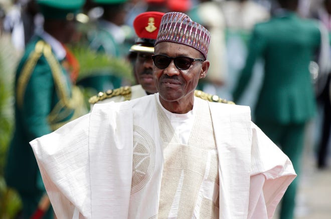FILE- In this file photo taken Friday, May 29, 2015, Nigerian President elect, Muhammadu Buhari, arrives for his Inauguration at the eagle square in Abuja, Nigeria. The Boko Haram extremist group has finally been crushed — driven from its last forest enclave with fighters on the run and no place to hide, Nigeria’s president declared Saturday, Dec. 24, 2016. (AP Photo/Sunday Alamba, File)