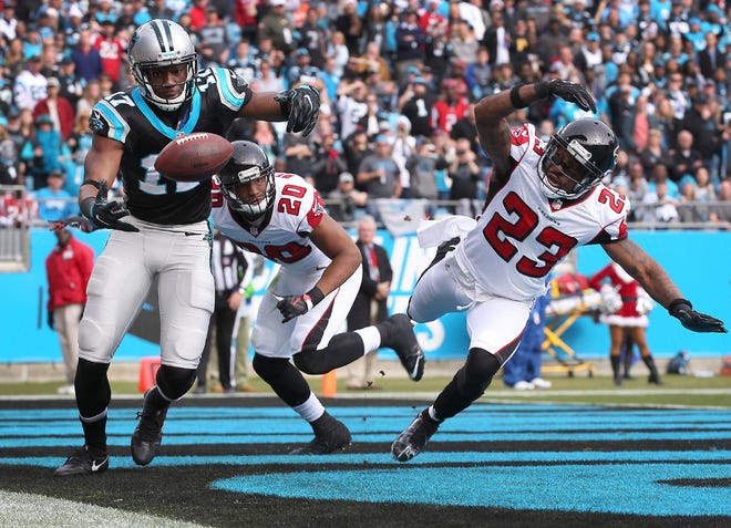 Panthers receiver Devin Funchess tries to catch a pass that was deflected in the endzone by Atlanta's Robert Alford Saturday at Bank of America Stadium. JOHN CLARK/GASTON GAZETTE