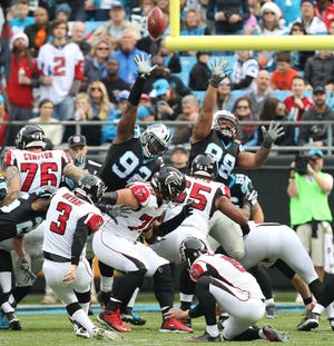The Panthers Vernon Butler, 92, deflects a Matt Bryant's field goal attempt during their 33-16 loss to Atlanta Saturday at Bank of America Stadium. JOHN CLARK/GASTON GAZETTE