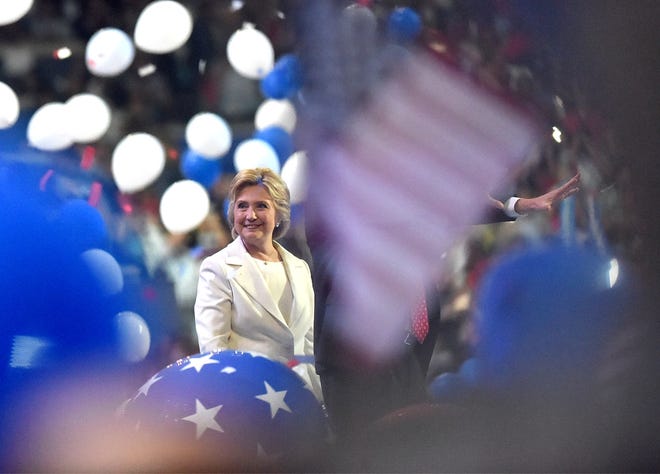 Hillary Clinton smiles as balloons fall after her speech at the Democratic National Convention at the Wells Fargo Center in Philadelphia on Thursday, July 28, 2016, accepting her nomination as the Democratic nominee.