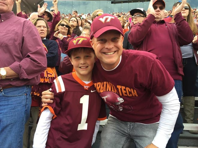 Dallas pastor Austin Rammell (right) with his son Ari at Virginia Tech's Lane Stadium. Rammell is current president of the Virginia Tech football players alumni association. (Provided photo)