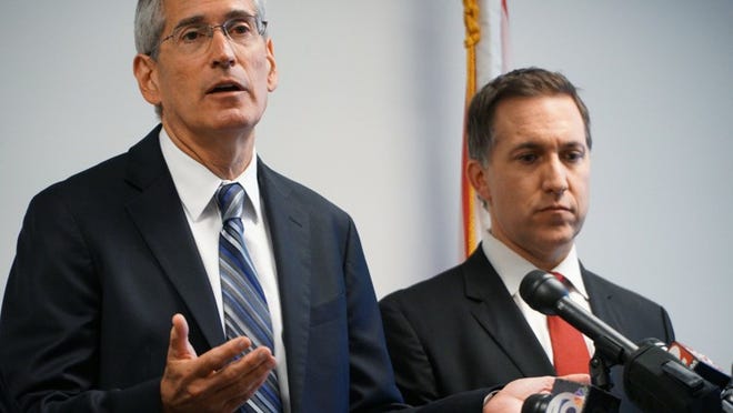 Palm Beach County Chief Assistant State Attorney Al Johnson, left, and State Attorney Dave Aronberg announce on Dec. 12, 2016, that a grand jury has issued 15 recommendations to combat the opioid crisis in Palm Beach County. (Richard Graulich / The Palm Beach Post)