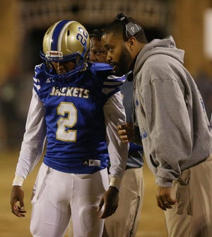 Aliceville head coach Rico Jackson, right, talks to Santiago Taylor during a quarterfinal playoff game against Elba on Nov. 18. Jackson was named the Class 2A Coach of the Year. Staff Photo/Erin Nelson
