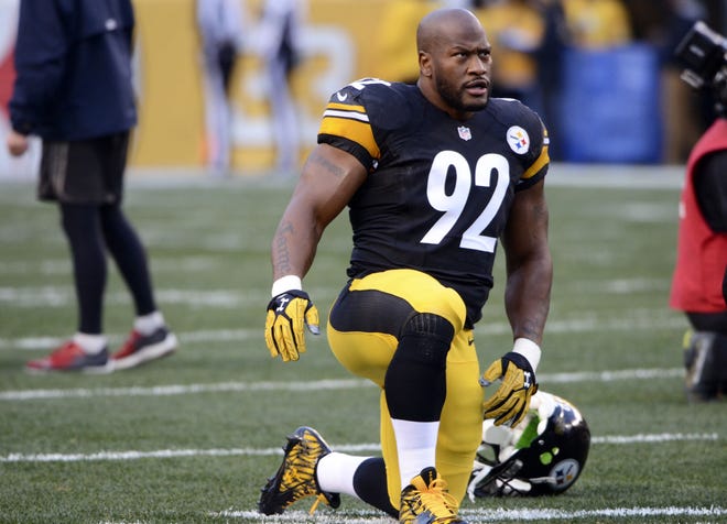 Steelers linebacker James Harrison warms up before the Steelers game against the New York Giants on Dec. 4 at Heinz Field.