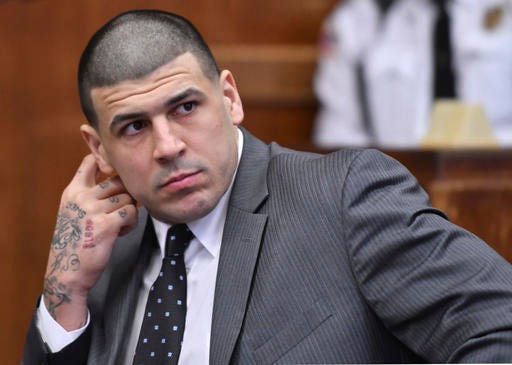 Former New England Patriots player Aaron Hernandez appears in Suffolk Superior Court for a pretrial hearing before Judge Jeffrey Locke, on Tuesday, Dec. 27, 2016, in Boston. Hernandez, who is serving a life sentence for a 2013 murder, is scheduled to go on trial in Feb 13, 2017 for the murder of two men in a 2012 drive-by shooting. (Josh Reynolds/The Boston Globe via AP, Pool)