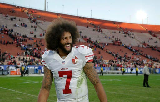 San Francisco 49ers quarterback Colin Kaepernick smiles after the 49ers' 22-21 win over the Los Angeles Rams during an NFL football game Saturday, Dec. 24, 2016, in Los Angeles. (AP Photo/Jae C. Hong)