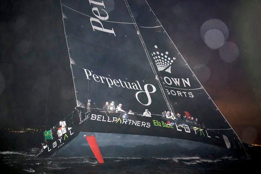In this photo provided by Rolex the Supermaxi Perpetual Loyal ?crosses the finish to take line honors in the Sydney Hobart yacht race in Hobart, Australia, Wednesday, Dec. 28, 2016. It crossed the finish line at around 2:30 a.m. local time on Wednesday to complete the 630-nautical-mile race in 1 day, 13 hours, 31 minutes, 20 seconds. (Kurt Arrigo/Rolex via AP)