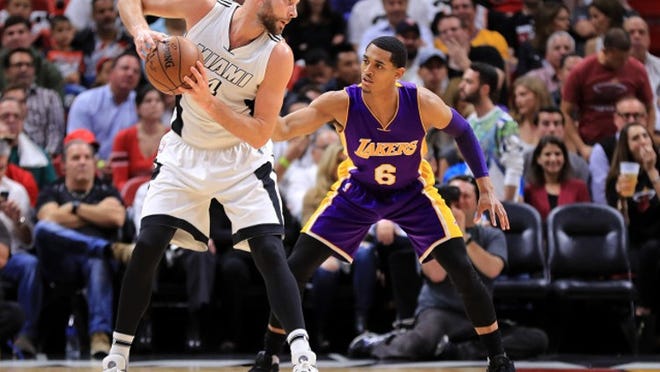 MIAMI, FL - DECEMBER 22: Josh McRoberts #4 of the Miami Heat posts up Jordan Clarkson #6 of the Los Angeles Lakers during a game at American Airlines Arena on December 22, 2016 in Miami, Florida. NOTE TO USER: User expressly acknowledges and agrees that, by downloading and or using this photograph, User is consenting to the terms and conditions of the Getty Images License Agreement. (Photo by Mike Ehrmann/Getty Images)