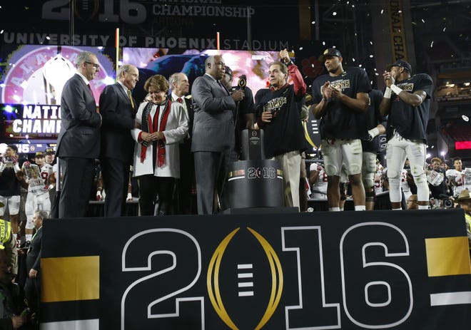 Alabama players and coaches celebrate after Alabama's 45-40 victory over Clemson in the College Football National Championship game in the University of Phoenix Stadium on Jan. 11. Staff Photo | Gary Cosby Jr.