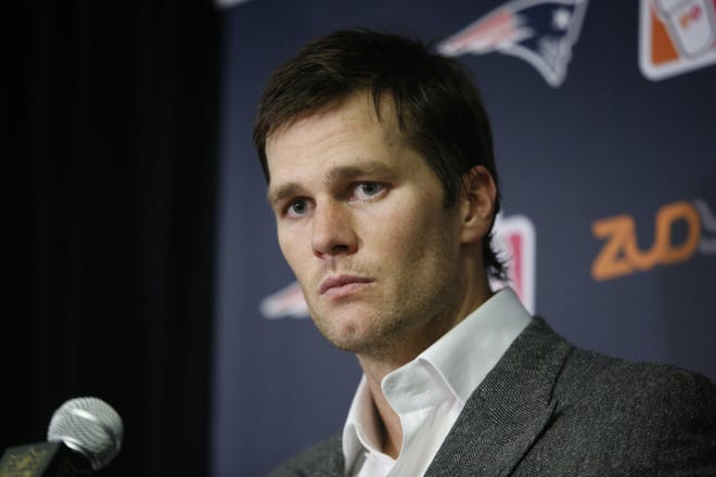 New England Patriots' Tom Brady (12) responds to questions during a news conference after an NFL football game against the New York Jets Sunday, Dec. 27, 2015, in East Rutherford, N.J. The Jets won 26-20. (AP Photo/Kathy Willens)