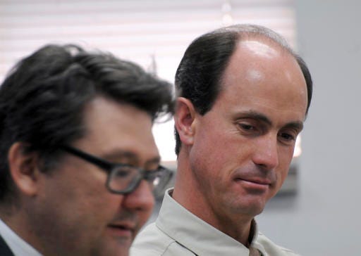 FILE - In this July 9, 2015 file photo, Seth Jeffs, right, brother of imprisoned polygamous sect leader Warren Jeffs, participates in a state water board meeting in Pierre, S.D. Jeffs, another high-ranking polygamous group leader appears ready to take a plea deal in a multimillion dollar food-stamp fraud case. Jeffs has a change of plea hearing scheduled for Wednesday, Dec. 28, 2016, morning in Salt Lake City. (AP Photo/James Nord, File)