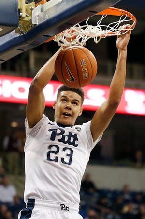 Pittsburgh Panthers guard Cameron Johnson (23) dunks against Marshall during the second half of an NCAA college basketball game in Pittsburgh on Wednesday, Dec. 28, 2016. (AP Photo/Jared Wickerham)
