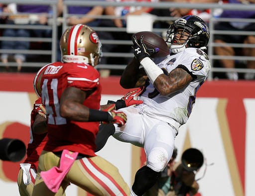 FILE - In this Oct. 18, 2015, file photo, Baltimore Ravens wide receiver Steve Smith (89) catches a 34-yard touchdown pass in front of San Francisco 49ers strong safety Antoine Bethea (41) and cornerback Kenneth Acker during the second half of an NFL football game in Santa Clara, Calif. Smith intended to retire at the end of the 2015 season, but ultimately decided to come back for one more season. It's unclear if his final game will be Sunday, Jan 1, 2017 in Cincinnati. (AP Photo/Ben Margot,File)