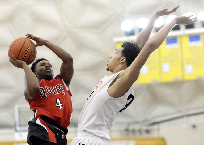 Aliquippa's Thomas Perry shoots over Beaver Falls' Josh Creach during the C.J. Betters on Thursday night during the C.J. Betters RBA Holiday Classic at CCBC.