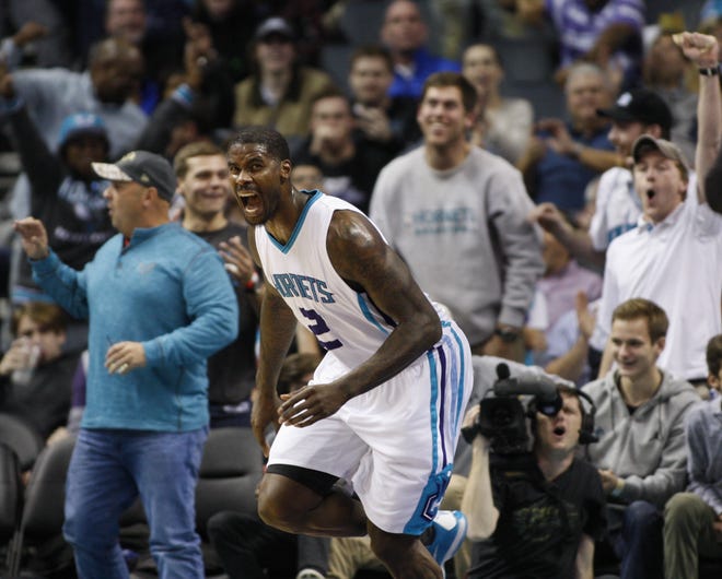 Charlotte Hornets forward Marvin Williams yells after dunking against the Miami Heat during the second half of Thursday's game in Charlotte. Charlotte won 91-82. (AP Photo/Nell Redmond)
