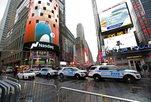 A row of New York City police cars is parked along a street in Times Square, Thursday, Dec. 29, 2016, in New York. The department is once again saying it is up to protecting the huge crowds that will gather in and around Times Square for New York City's massive New Year's Eve celebration. (AP Photo/Kathy Willens)