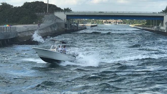 Rough waters may have forced a boat to capsize in the Boynton Inlet. (Note: Boat in picture was not the one rescued.) (Photo by Alexandra Seltzer)