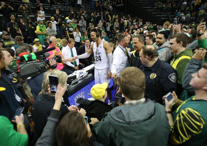 Dillon Brooks is congratulated by Bill Walton after the game.
(Brian Davies/The Register-Guard)