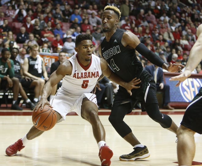 Alabama guard Avery Johnson Jr. drives along the baseline against Stetson guard Divine Myles (4) Thursday during their game at Coleman Coliseum. Staff Photo/Gary Cosby Jr.