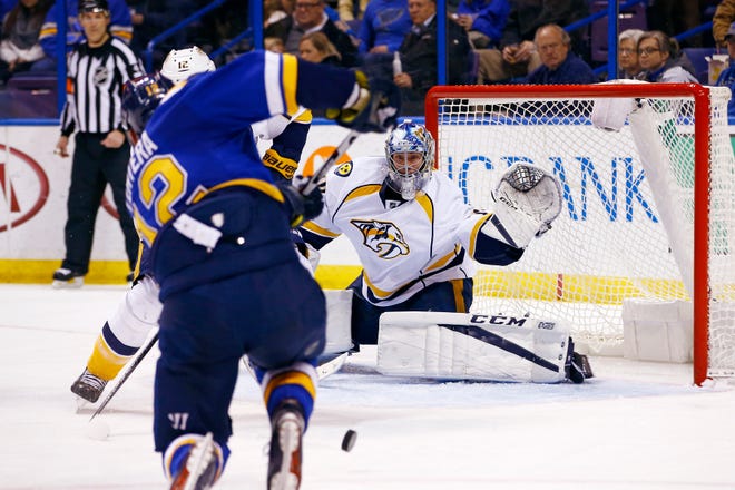 St. Louis Blues' Jori Lehtera, of Finland, shoots on Nashville Predators goalie Juuse Saros, of Finland, during the second period of an NHL hockey game Friday, Dec. 30, 2016, in St. Louis. (AP Photo/Billy Hurst)