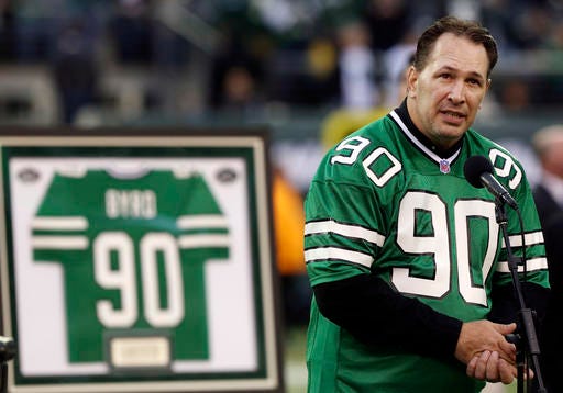 FILE - In this Oct. 28, 2012, file photo, former New York Jets player Dennis Byrd speaks during a halftime ceremony to retire his number during an NFL football game between the Jets and the Miami Dolphins in East Rutherford, N.J. The Nes have honored the late Dennis Byrd by voting to posthumously select the former defensive lineman as the winner of the team's award named after him. The Dennis Byrd Most Inspirational Award has been presented each year since 1992, with Byrd the first winner, to the most inspirational Jets player by a vote of his teammates. (AP Photo/John Minchillo, File)