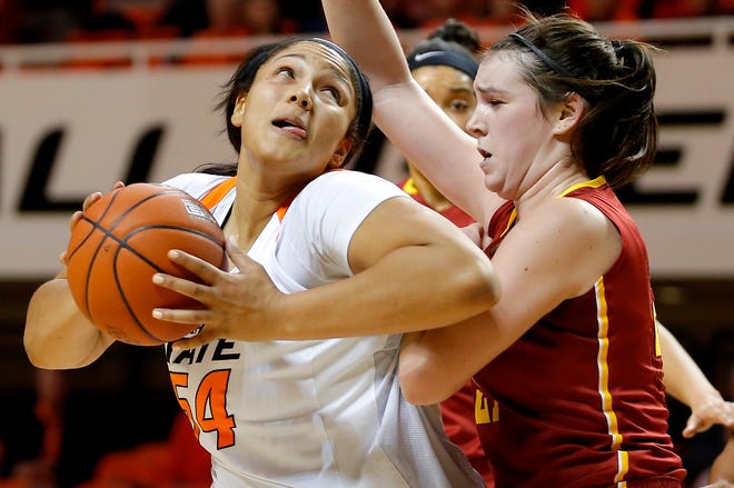 Oklahoma State's Kaylee Jensen, left, is fouled by Iowa State's Bridget Carleton during Thursday night's Big 12 basketball game at Gallagher-Iba Arena. Oklahoma State won, 71-59. [PHOTO BY BRYAN TERRY, THE OKLAHOMAN]