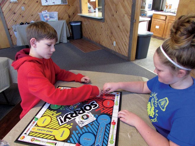 Lucas Anderson, 10, and Carlee Anderson, 10, both of Pekin, play Sorry during winter break at the Pekin Park District’s Winter Camp at the Soldwedel Program Center. The park district is conducting a study to determine what the community would like to see in programs going forward.