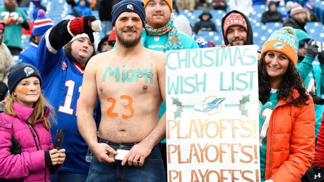 ORCHARD PARK, NY - DECEMBER 24: Miami Dolphins fans watch thier team warm up before the game against the Buffalo Bills at New Era Stadium on December 24, 2016 in Orchard Park, New York. (Photo by Rich Barnes/Getty Images)