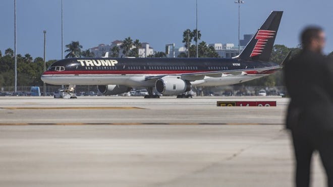 Donald Trump arrives at Palm Beach International Airport aboard his private 757 plane enroute to his campaign rally at the South Florida Fair Expo Center on Oct. 13 in West Palm Beach. (Greg Lovett / The Palm Beach Post)