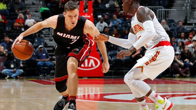 ATLANTA, GA - DECEMBER 07: Goran Dragic #7 of the Miami Heat drives against Dennis Schroder #17 of the Atlanta Hawks at Philips Arena on December 7, 2016 in Atlanta, Georgia. NOTE TO USER User expressly acknowledges and agrees that, by downloading and or using this photograph, user is consenting to the terms and conditions of the Getty Images License Agreement. (Photo by Kevin C. Cox/Getty Images)