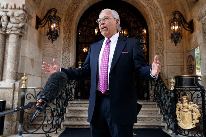 Former Texas Rep. Henry Bonilla talks with reporters after meeting with President-elect Donald Trump and his transition team at Mar-a-Lago, Friday, Dec. 30, 2016, in Palm Beach, Fla. (AP Photo/Evan Vucci)