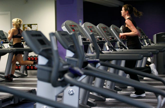 FIWomen exercise on machines in a gym in central London. January, the start of New Year’s resolution month, sees a healthy uptick in sign-ups at gyms and specialized studios offering such things as Pilates, kickboxing and yoga. (AP Photo/Sang Tan, File)