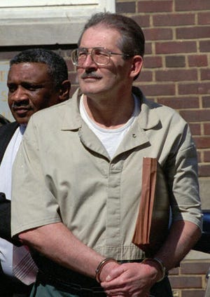 FILE - In this April 28, 1994 file photo, former CIA agent Aldrich Ames leaves federal court in Alexandria, Va. U.S. relations with Moscow during and after the Cold War have been marred by diplomatic dustups ranging from espionage scandals to an Olympics boycott. In February 1994, the U.S. expelled Russian senior intelligence officer Alexander Lysenko, saying he was in a position to be responsible for the spying of CIA agent Ames. This was just days after Ames and his wife, Rosario, were arrested on charges of selling secrets to Moscow from at least 1985 to 1993.  (AP Photo/Denis Paquin, File)