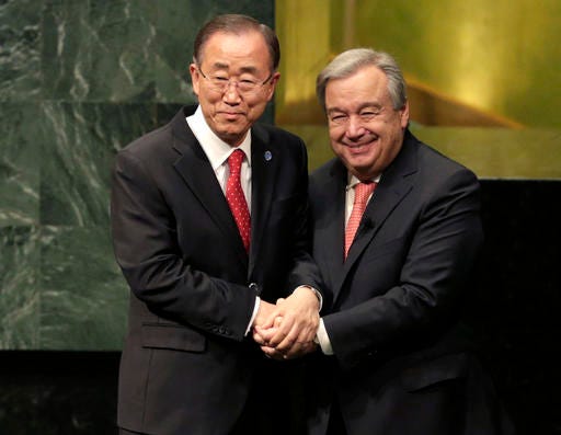 FILE - In this Dec. 12, 2016 file photo, United Nations Secretary-General Ban Ki-moon, left, clasps hands with U.N. Secretary-General designate Antonio Guterres after Guterres was sworn in at U.N. headquarters. Guterres takes the reins of the United Nations on New Year's Day, promising to be a "bridge-builder" but facing an antagonistic incoming U.S. administration led by Donald Trump who thinks the world body's 193 member states do nothing except talk and have a good time. (AP Photo/Seth Wenig, File)
