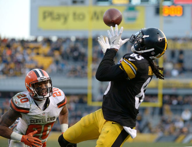 The Steelers' Cobi Hamilton (83) catches the game-winning touchdown ahead of the Browns' Briean Boddy-Calhoun (20) during the Steelers 27-24 win over Cleveland on Sunday at Heinz Field in Pittsburgh.