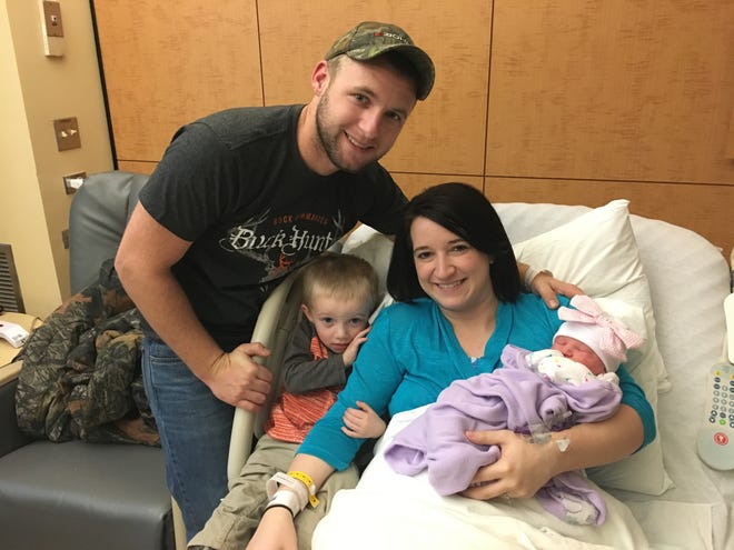Christian and Katie Lail, of Cherryville, are pictured with their 2-year-old son, Wyatt, and daughter, Reeslyn Kate Lail, who was born at 7:49 a.m. Sunday at CaroMont Regional Medical Center in Gastonia. MICHAEL BARRETT/THE GAZETTE