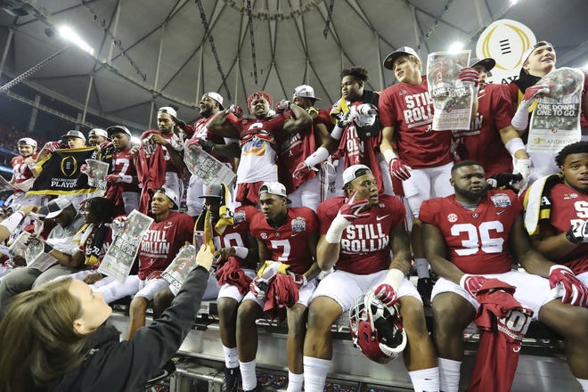 Alabama players celebrate after defeating Washington 24-7 in the Peach Bowl playoff game at the Georgia Dome on Saturday in Atlanta. CURTIS COMPTON / ATLANTA JOURNAL-CONSTITUTION VIA AP