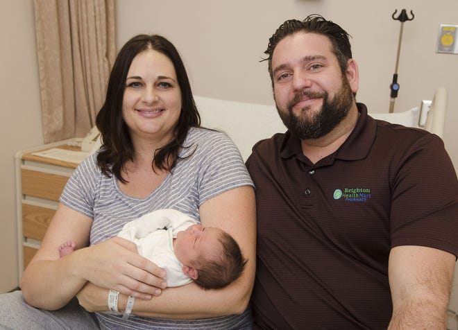 Jill and Patrick Davis of Chippewa Township show off their new daughter, Isabella Marlene, at Heritage Valley Beaver hospital on Monday. Isabella was the first baby of 2017 in Beaver County -- born at 12:25 a.m. Sunday.