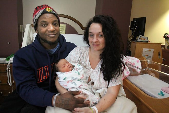 Kassidy Renee Sanders sleeps in the arms of her parents, Kenny Sanders (left) and Karina LaFrancois of Galena, at FHN Memorial Hospital on Monday, Jan. 2, 2017, in Freeport. Kassidy is the first baby born in 2017 in Stephenson County, having been born at 6:39 p.m. on New Year's Day. JANE LETHLEAN/CORRESPONDENT/THE JOURNAL-STANDARD