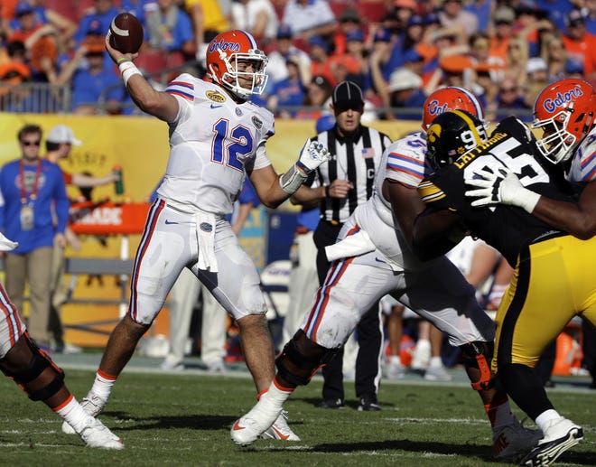 Florida quarterback Austin Appleby (12) throws a pass against Iowa during the second half of the Outback Bowl in Tampa. CHRIS O'MEARA/THE ASSOCIATED PRESS