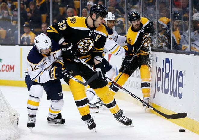 Boston Bruins' Zdeno Chara defends against Buffalo Sabres' Brian Gionta during the third period of an NHL hockey game in Boston, Saturday, Dec. 31, 2016. The Bruins won 3-1.