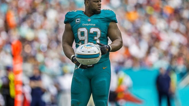 Miami Dolphins defensive tackle Ndamukong Suh (93), during a break between the Miami Dolphins and the New England Patriots during NFL game Sunday January 01, 2017 at Hard Rock Stadium in Miami Gardens. (Bill Ingram / The Palm Beach Post)