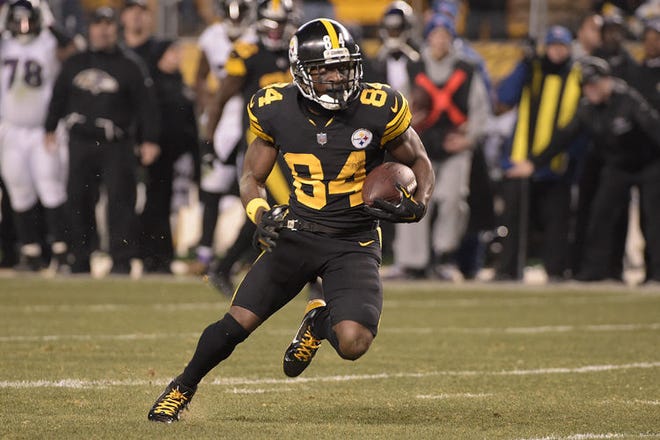 Pittsburgh Steelers wide receiver Antonio Brown (84) runs after a catch during the second half of an NFL football game against the Baltimore Ravens in Pittsburgh.