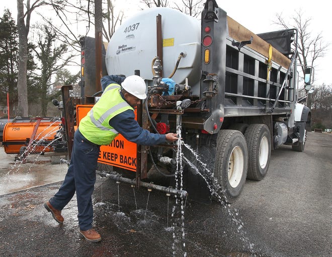 Edward Stroud checks the valves on one of the trucks that will be spraying brine on the roadways at the city of Gastonia Public Works operation center in preparation for the winter weather forcast for the area over the weekend. JOHN CLARK/THE GAZETTE